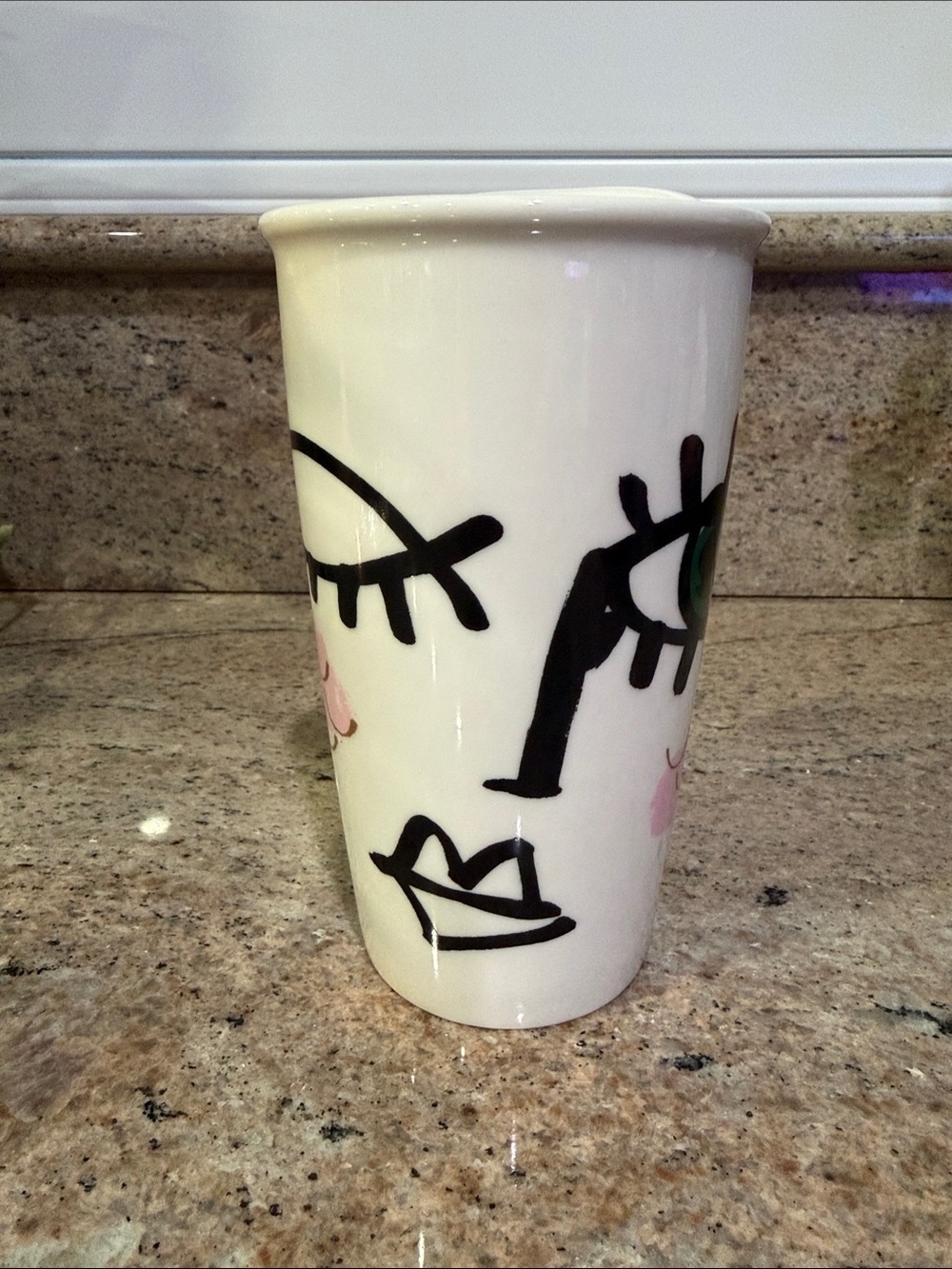 Starbucks White Mug with Black Face Lines and Pink Accents